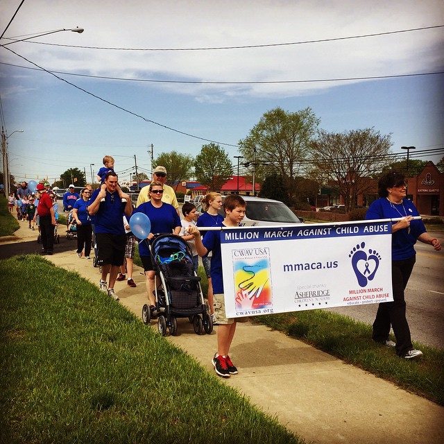 Teachers, parents and kids showing support in fight against child abuse at a Preschool & Daycare/Childcare Center serving Apex & Fuquay-Varina, NC