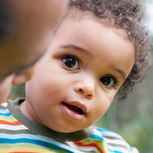 Cute African american toddler with his dad at a Preschool & Daycare/Childcare Center serving Apex & Fuquay-Varina, NC