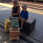 Kids beside luggage at a Preschool & Daycare/Childcare Center serving Apex & Fuquay-Varina, NC