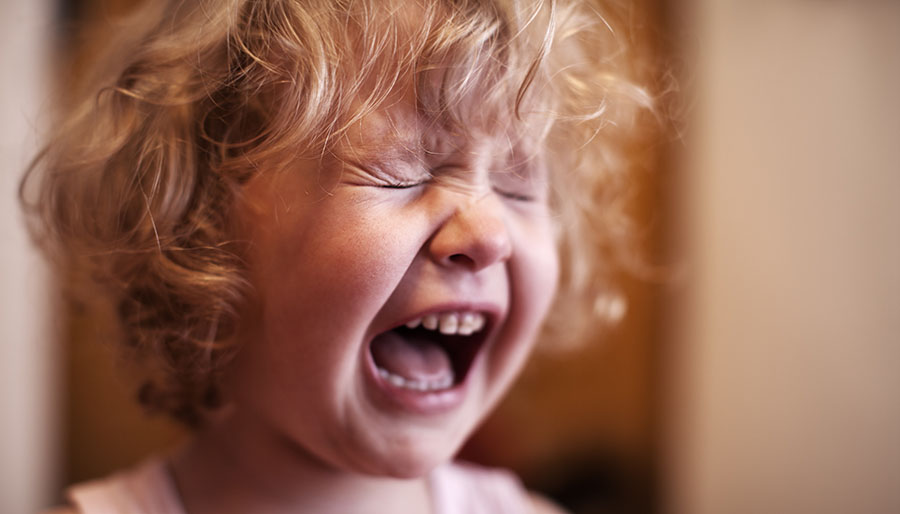 Sad baby. Crying little girl at a Preschool & Daycare/Childcare Center serving Apex & Fuquay-Varina, NC