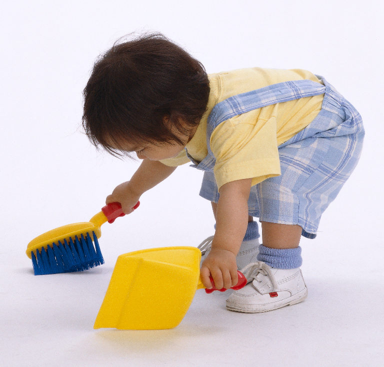 Toddler doing house chores concept at a Preschool & Daycare/Childcare Center serving Apex & Fuquay-Varina, NC