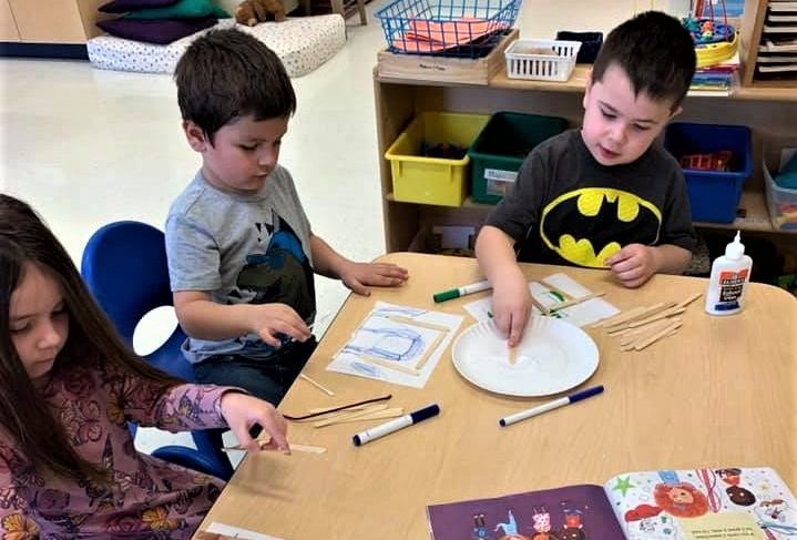 Preschool kids doing some art design , drawing, coloring, pasting at a Preschool & Daycare/Childcare Center serving Apex & Fuquay-Varina, NC