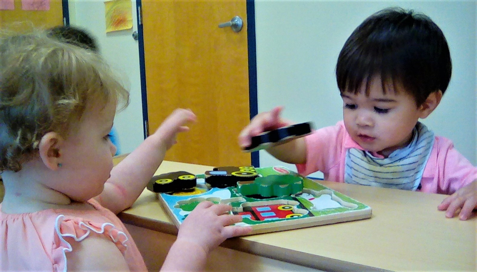 Toddlers on outstanding developmental activity, playing with educational building blocks at a Preschool & Daycare/Childcare Center serving Apex & Fuquay-Varina, NC